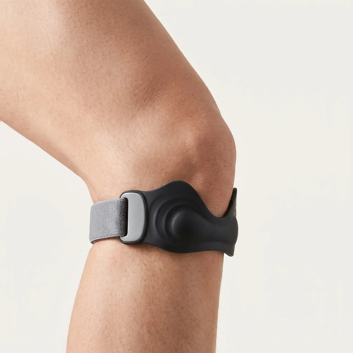 Side view of a patellar tendon strap worn below the kneecap, as used for Osgood-Schlatter knee pain