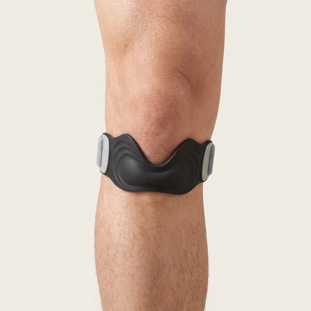 Patellar tendon strap worn just below the kneecap, centered on the patellar tendon