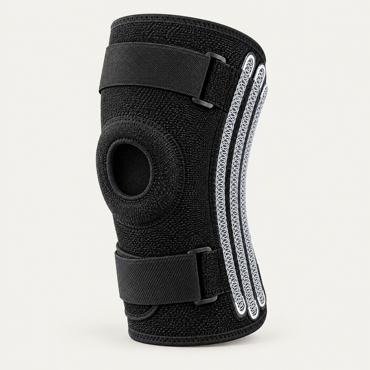 Plus size knee brace in black with spring side stabilizers and wraparound straps